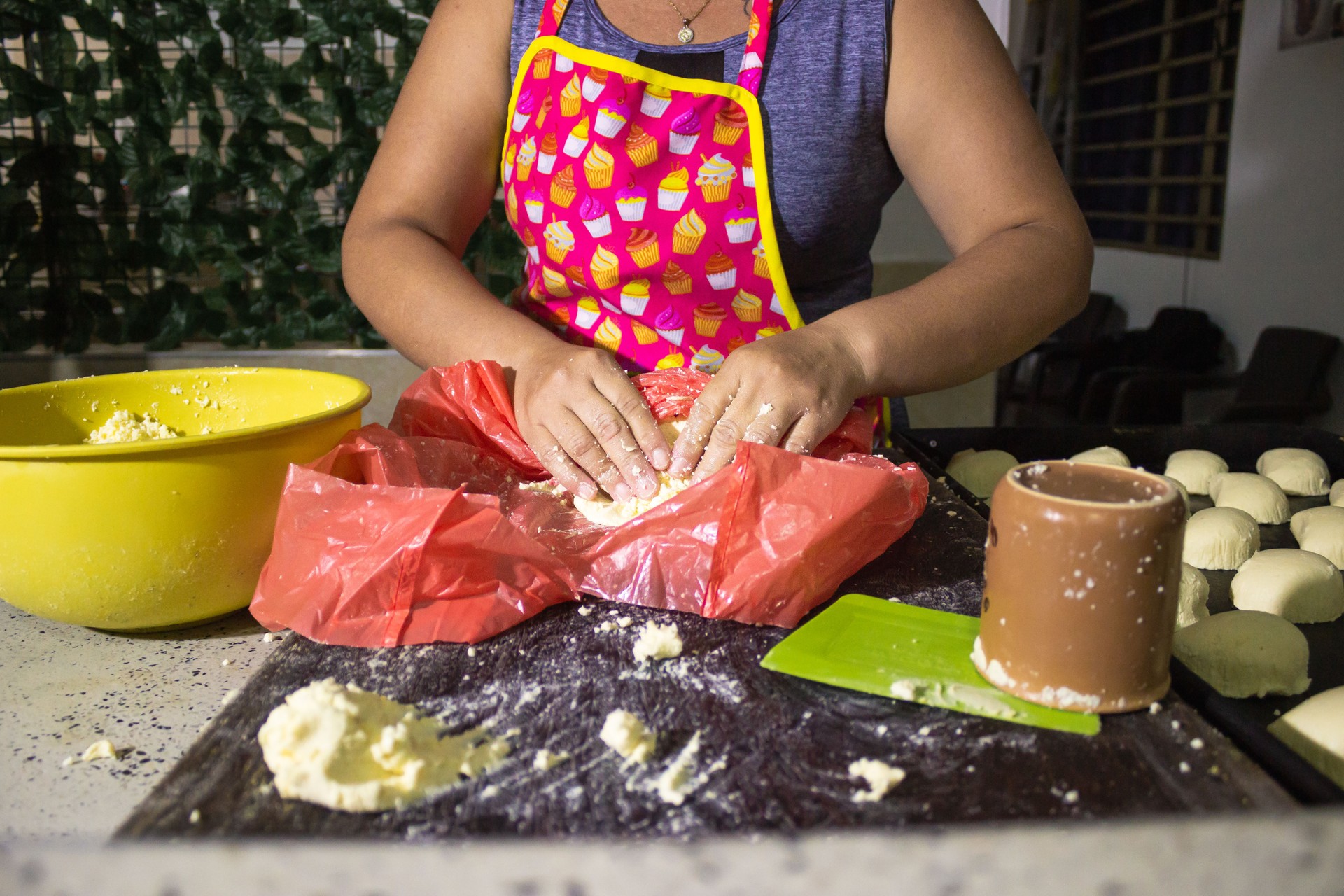 A person preparing a dough with wheat flour
